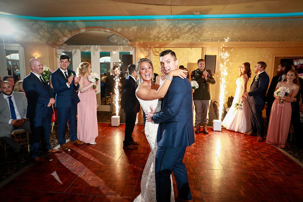 Chesapeake inn ballroom with a wedding party and bride and groom dancing